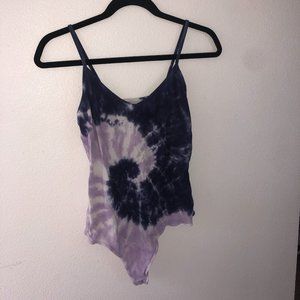 Purple and dark blue tie dye body suit.